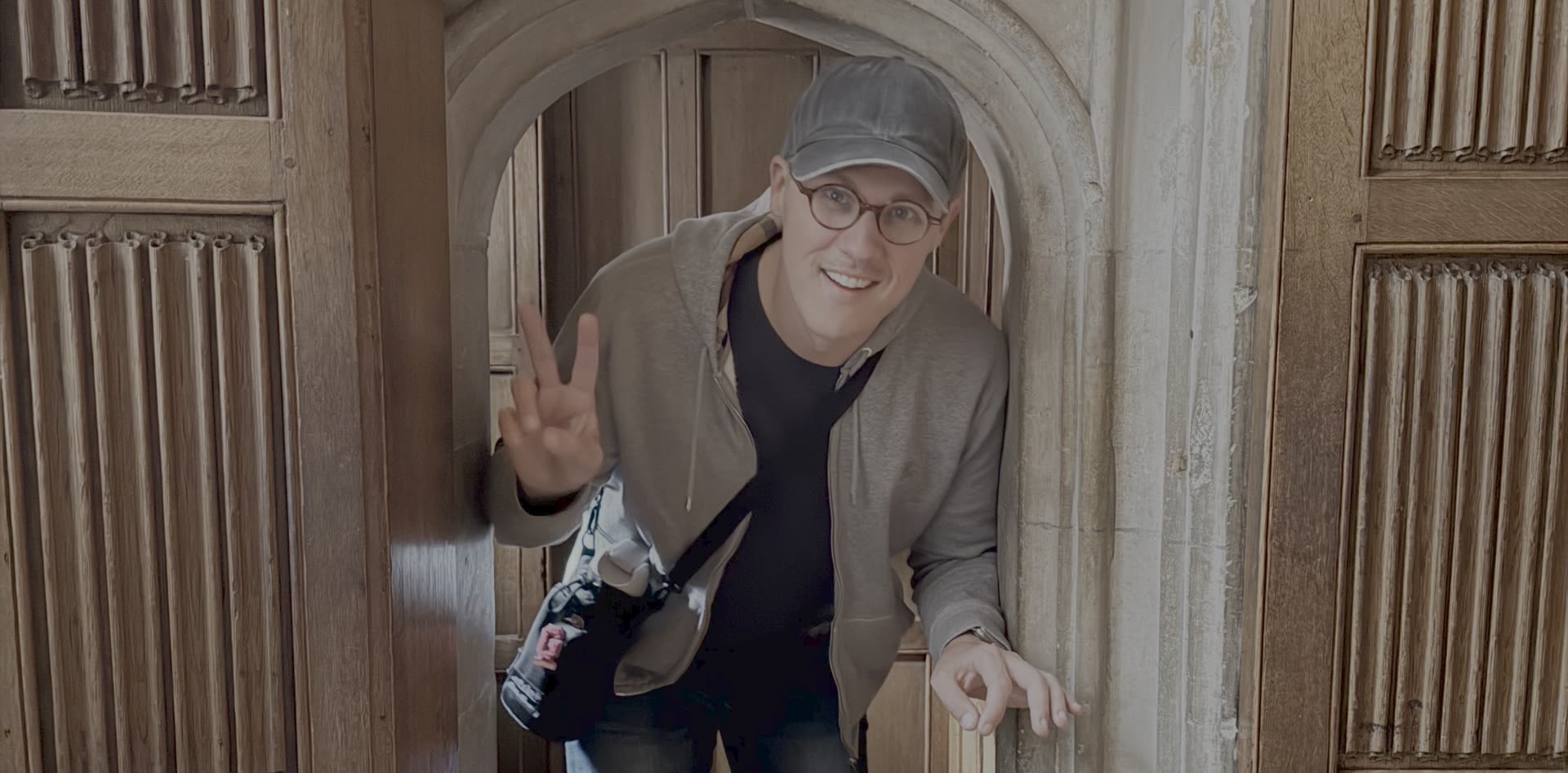 Matthew Gann in a gothic archway